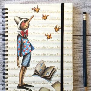 A spiral notebook with a cover featuring a Pinocchio illustration, held closed by a black elastic band.