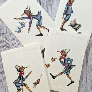 A set of cards featuring four different illustrations of Pinocchio on the front.