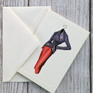 A card featuring a fashion-inspired design on the front. This one shows a purple jacket and red skirt.