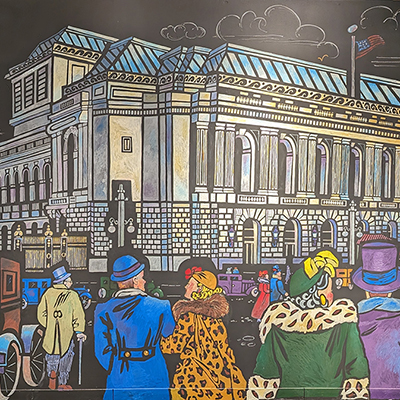 A beautiful image with a detail of a painting showing the outside of the SF Opera House when it opened in 1932. The background is black, and we see several people dressed in 1930s attire, along with cars. They are all heading to the opera