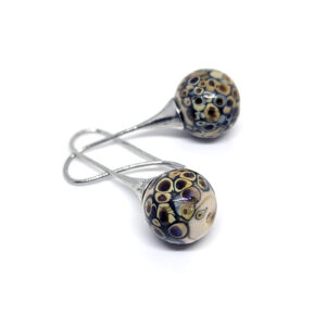 Droplet-style earrings, with earth-tone glass beads.