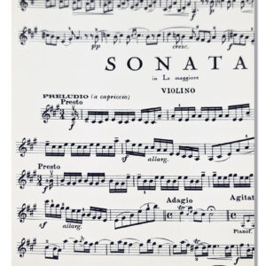 A notebook with a cover featuring a design inspired by classical sheet music.