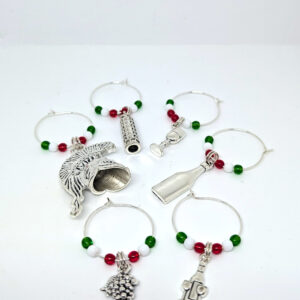 A set of 6 of circular wine charms, each with red, white, and green beads and an Italy-themed charm.