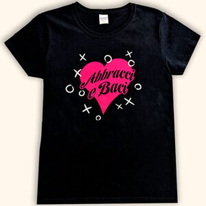 A black t-shirt with the phrase "Abbracci e Baci" in black text over a bright pink heart in the center of the shirt, surrounded by scattered white 'X' and 'O' symbols.