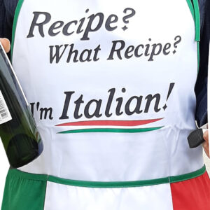 A white apron with green trim, and large front pockets in the color scheme and pattern to replicate the Italian flag. "Recipe? What Recipe? I'm Italian!" is in black text on the front.