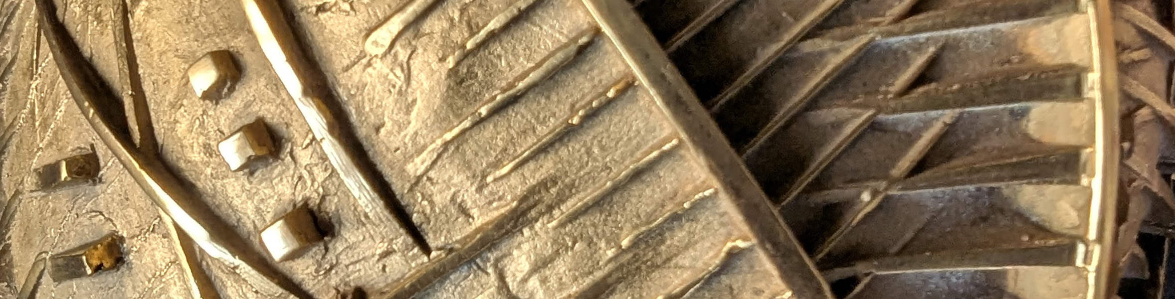 A close up of the geometric line patterns that protrude from the sculpture titled "Pomodoro".