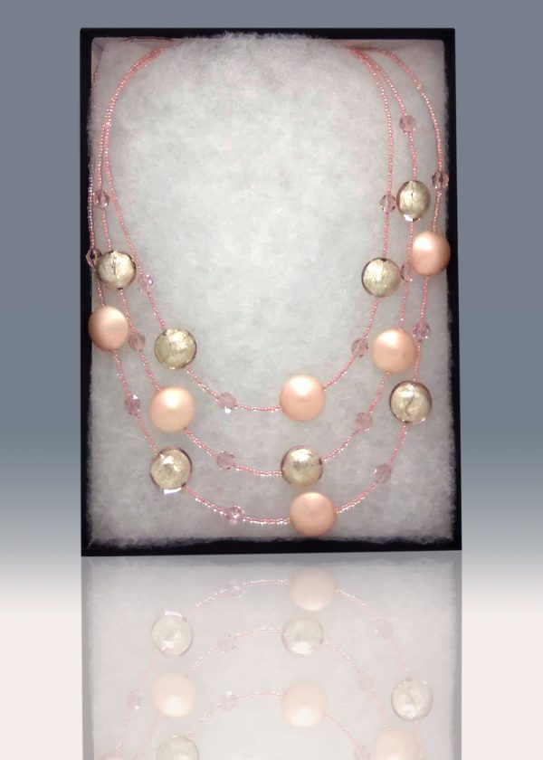 A three-tiered necklace made of gorgeous delicate-pink beads peppered and fused with fragments of light pink glass.