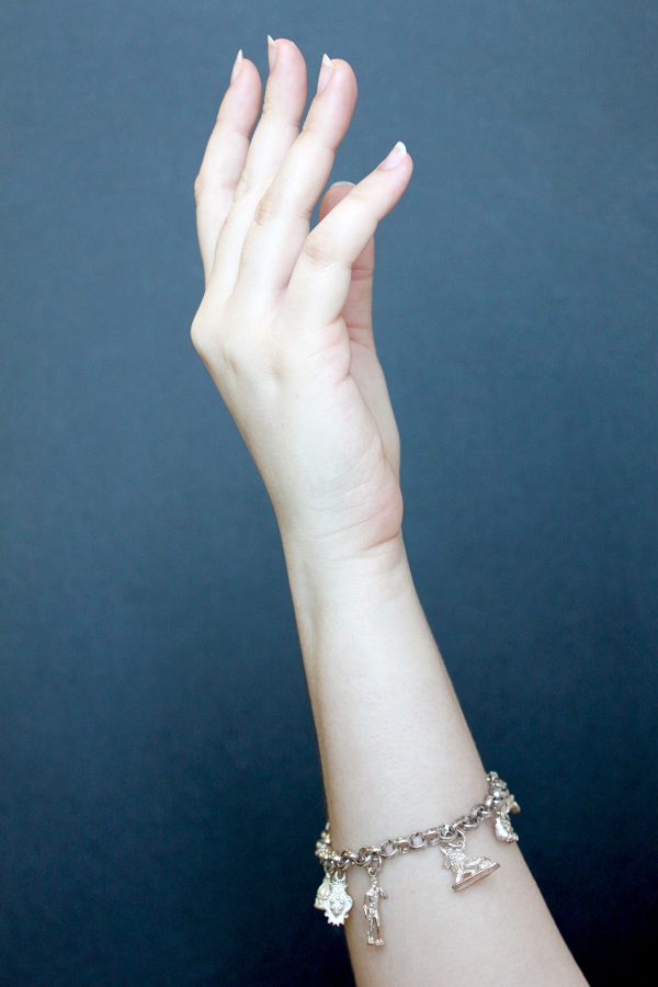 Sterling silver-plated bracelet is handmade by artist Giuliano Ricchi of Florence, with great care put into each delicate charm representing the history of the city.