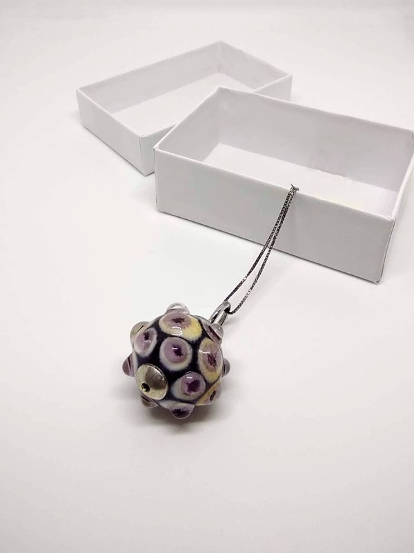 Necklace with a pendant made with a bubbly effect, with a delicate fusion of colors including pristine white, vibrant yellow, captivating cyclamen purple, and soft powder pink. Chain in silver color.